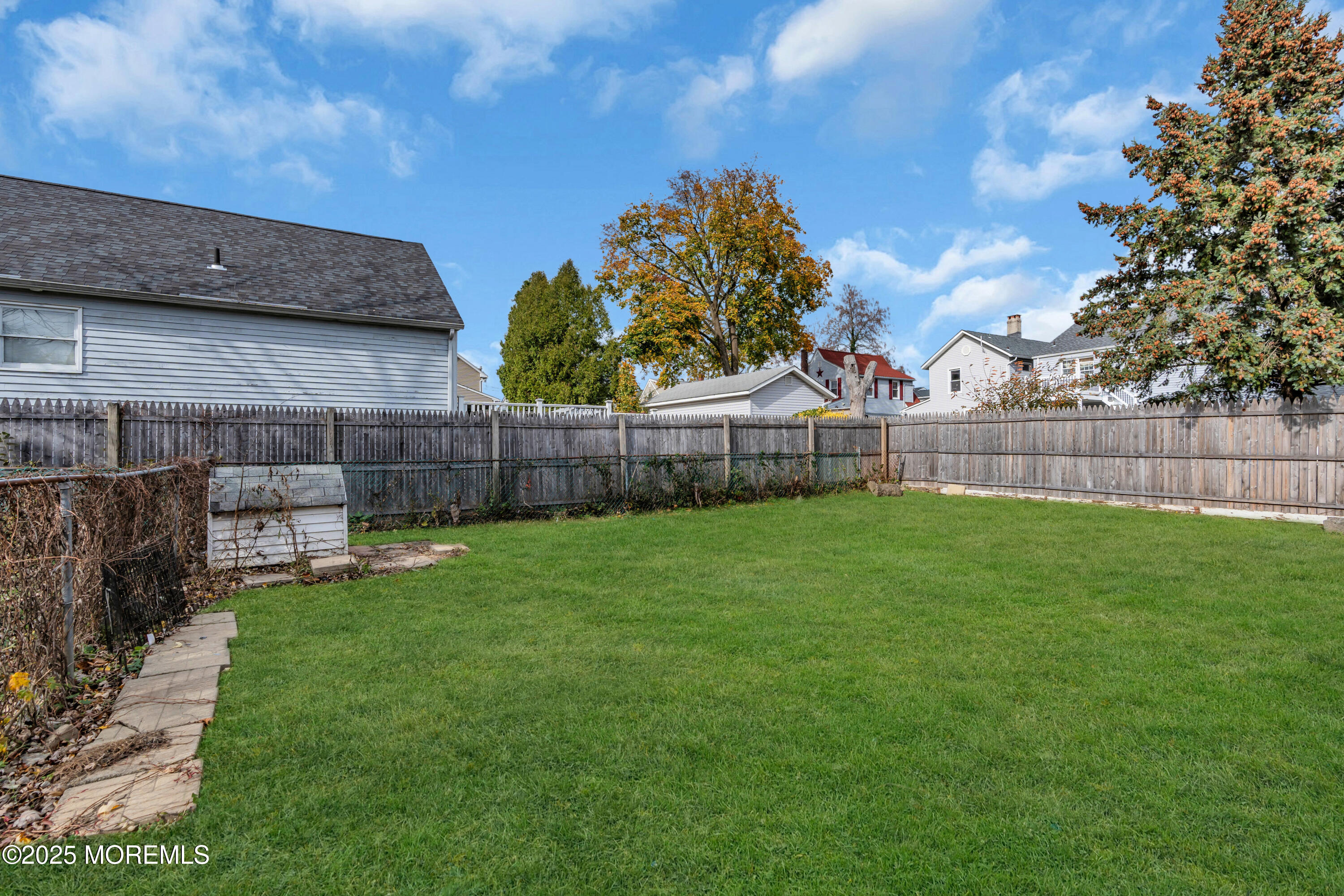 6 Orchard Street Matawan, NJ 07747 - Photo 40 of 45 a view of a backyard with a garden and entertaining space