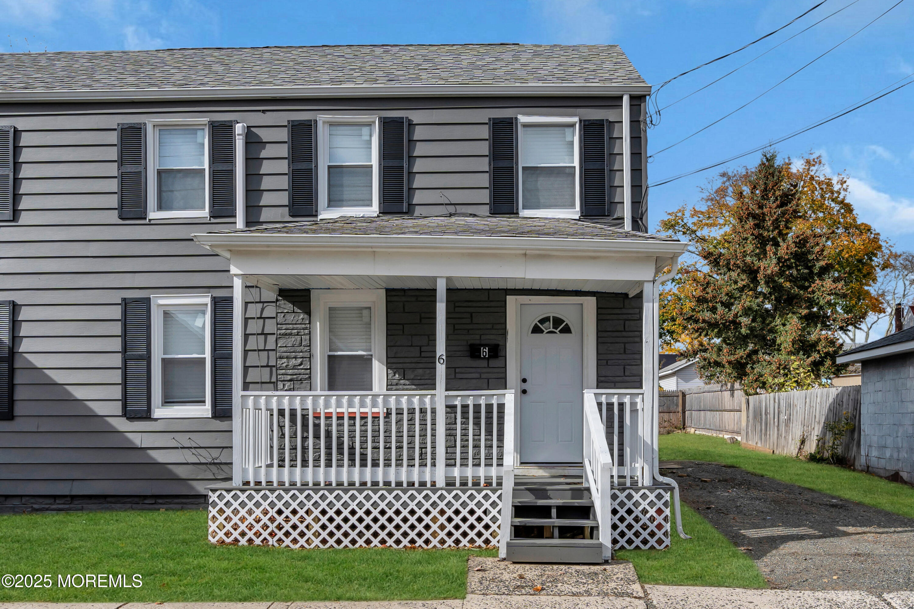 6 Orchard Street Matawan, NJ 07747 - Photo 7 of 45 a front view of a house with a garden