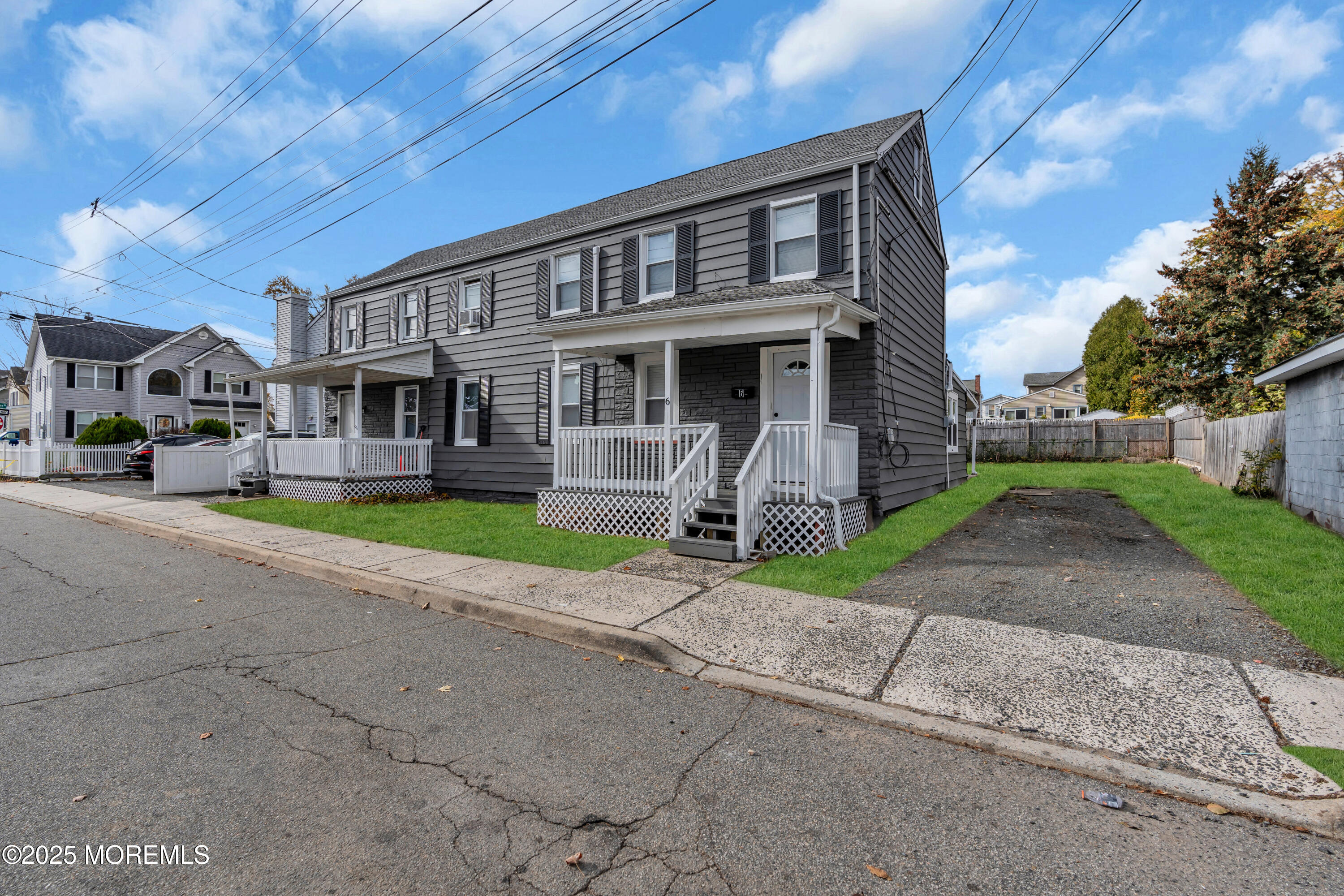 6 Orchard Street Matawan, NJ 07747 - Photo 8 of 45 a front view of a house with a yard and garage