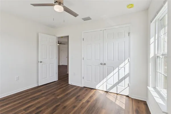 a view of an entryway with wooden floor