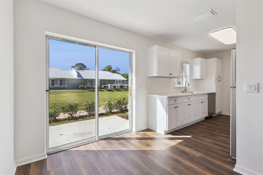 1073 North Rockingham Avenue Tavares, FL 32778 - Photo 5 of 17 a view of a kitchen with a sink and dish washer