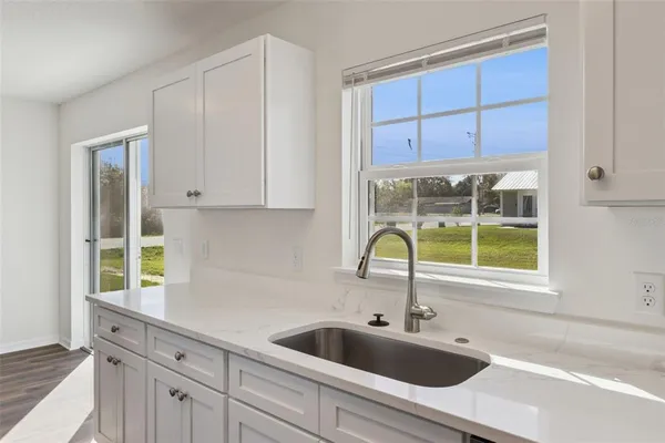 a kitchen with a sink and cabinets