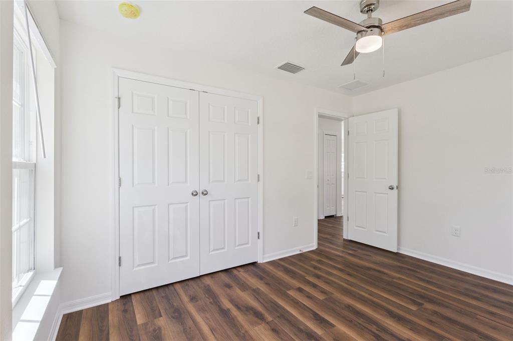1073 North Rockingham Avenue Tavares, FL 32778 - Photo 9 of 17 wooden floor in an empty room