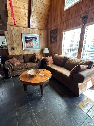 1456 Navajo Road Coalville, UT 84017 - Photo 11 of 55 Living area with wooden walls and a high wood beamed ceiling