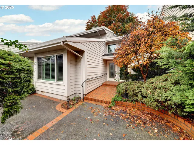 a view of house with backyard and garden
