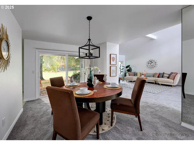 a view of a dining room with furniture window and outside view