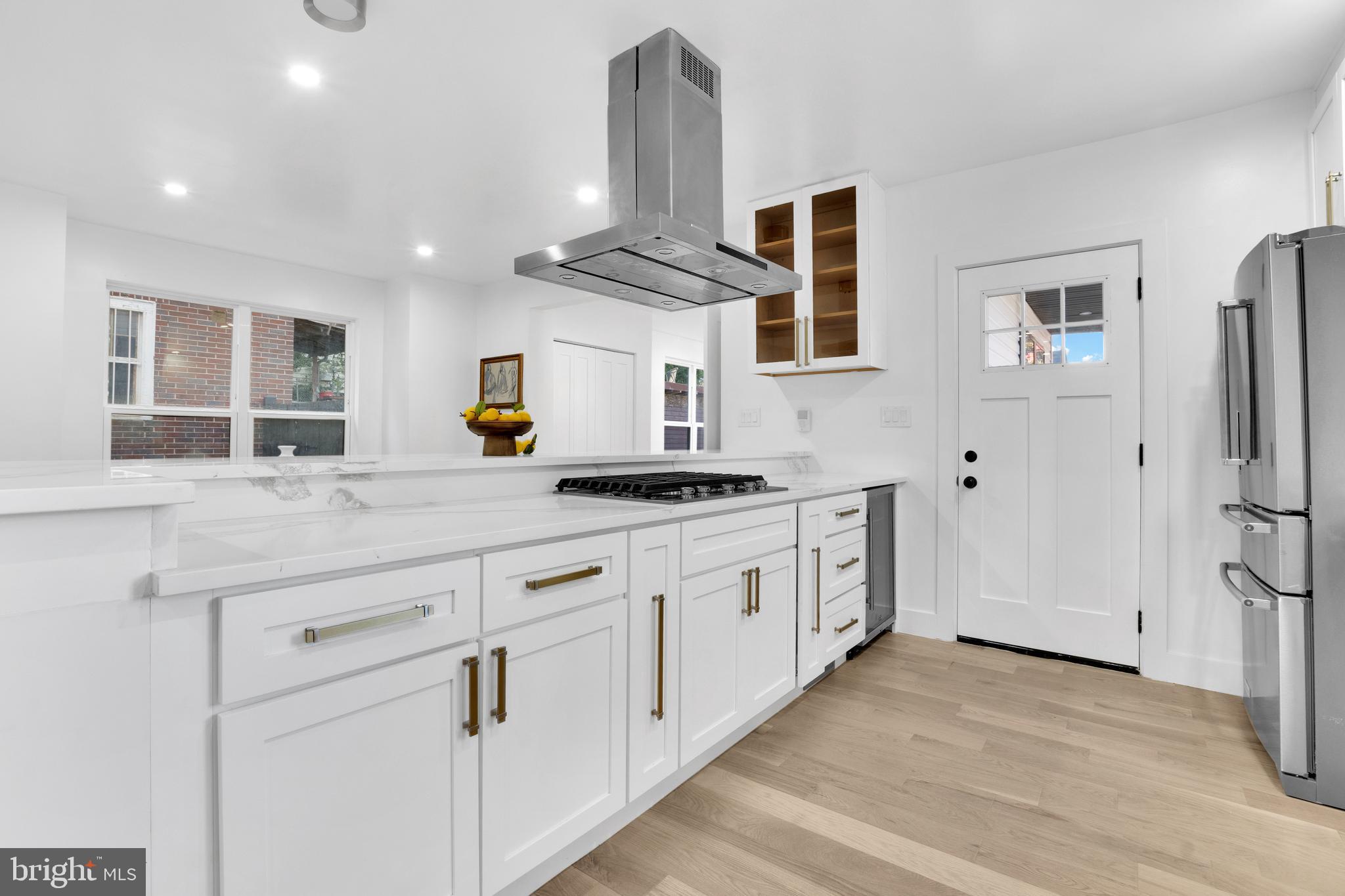 1312 Franklin Street Northeast Washington, DC 20017 - Photo 13 of 42 a kitchen with stainless steel appliances a sink stove and refrigerator