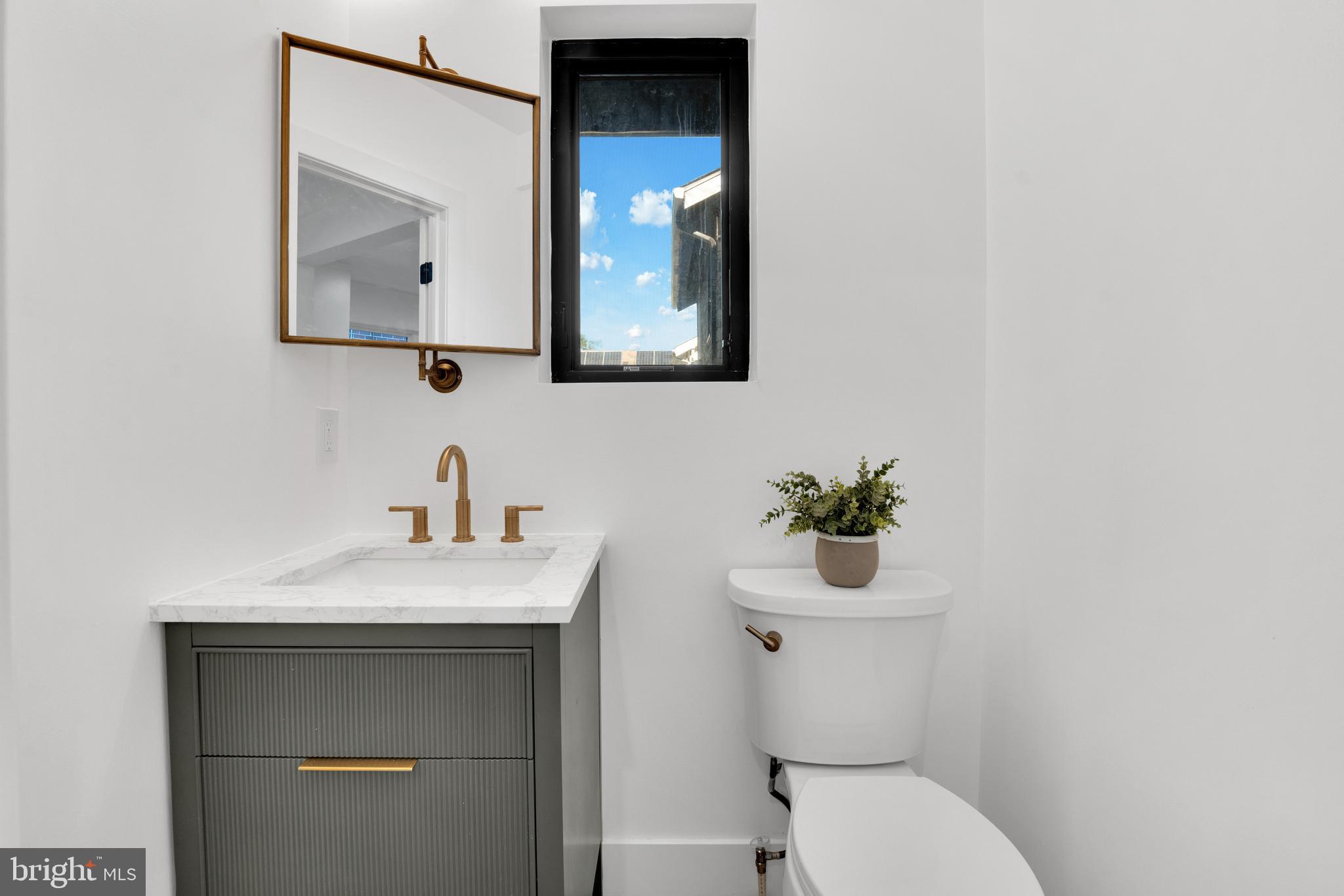 1312 Franklin Street Northeast Washington, DC 20017 - Photo 14 of 42 a bathroom with a toilet sink and mirror