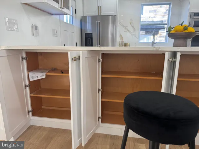 a view of kitchen with furniture and windows