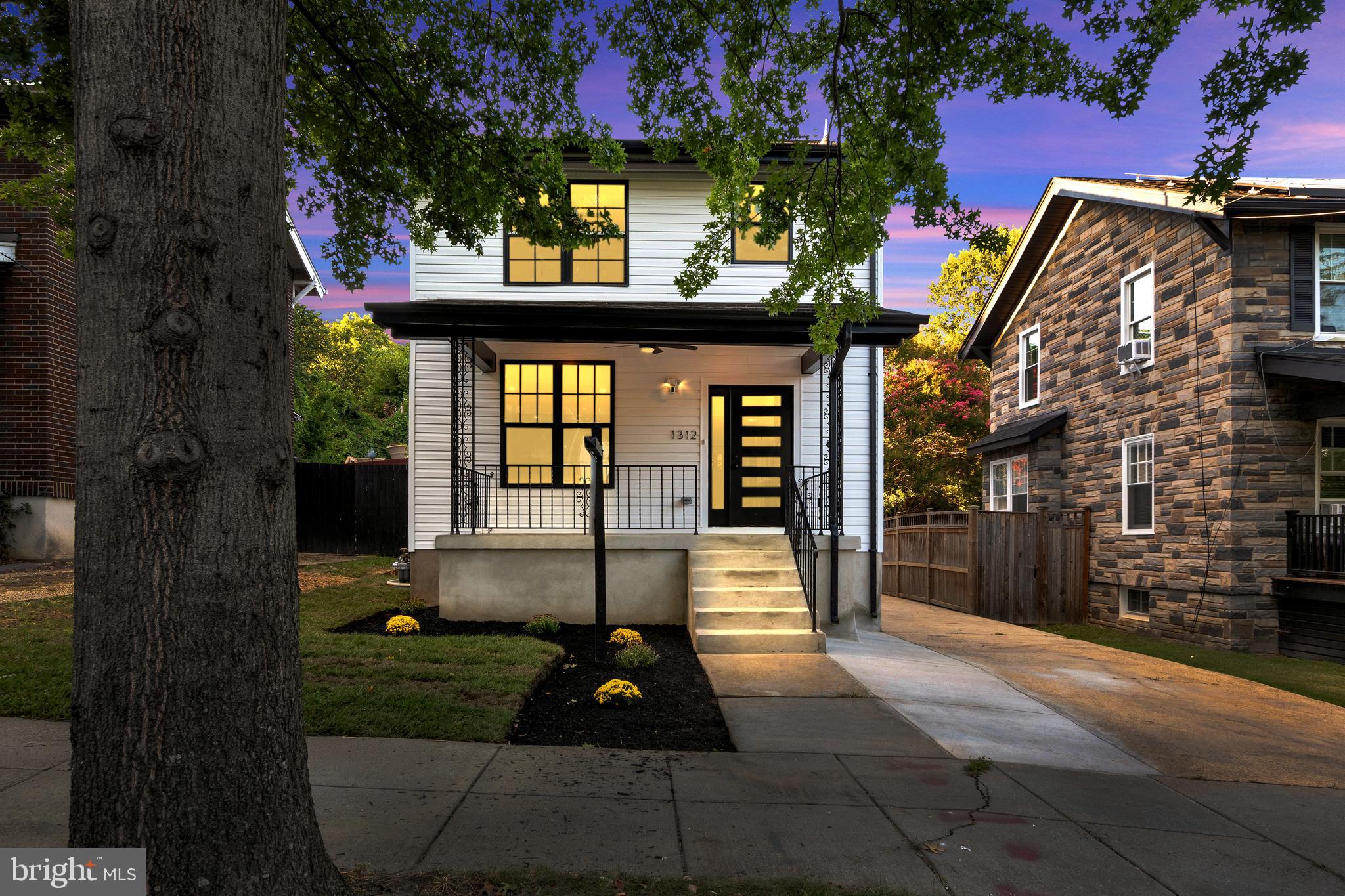1312 Franklin Street Northeast Washington, DC 20017 - Photo 2 of 42 a front view of a house with garden