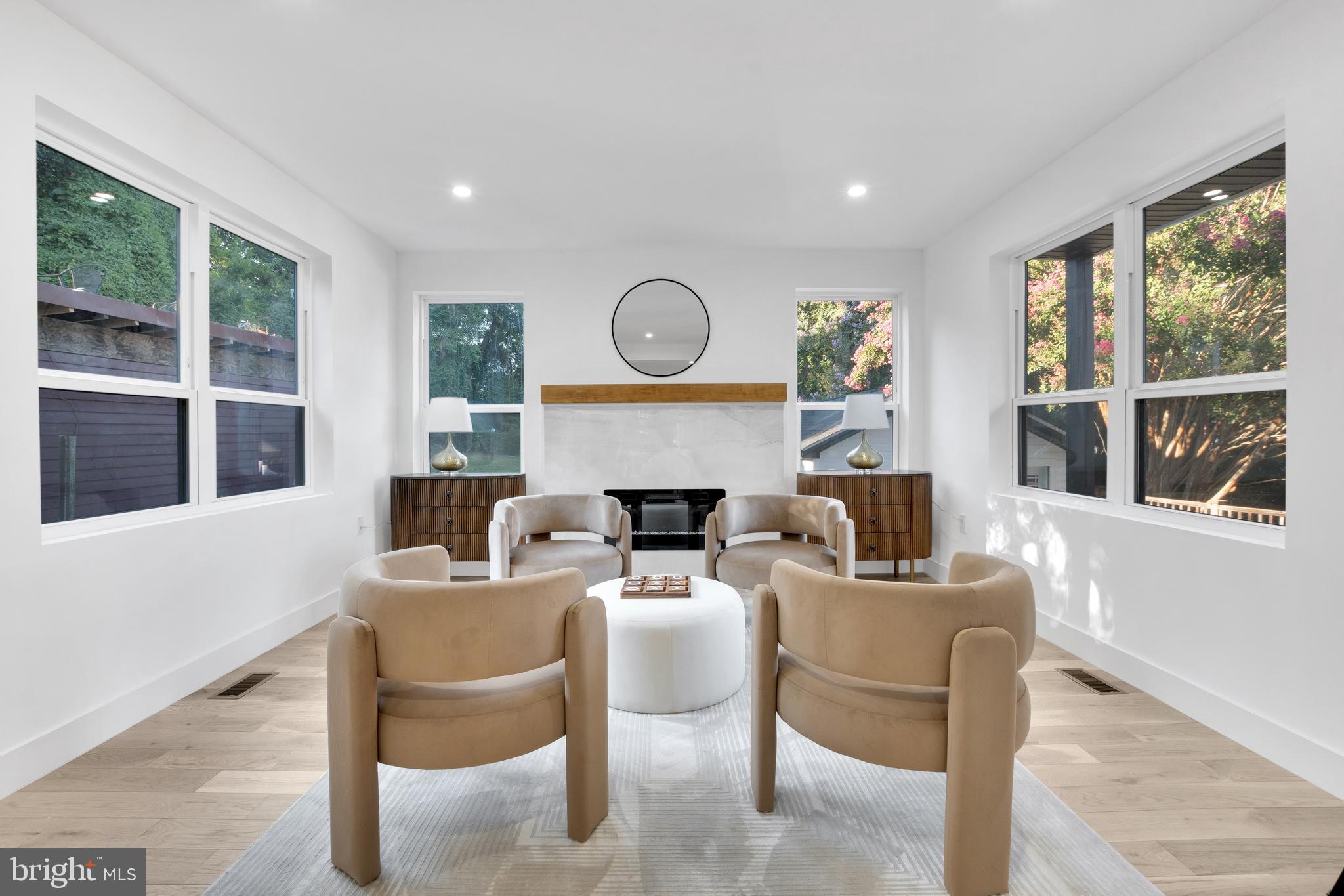 1312 Franklin Street Northeast Washington, DC 20017 - Photo 21 of 42 a dining room with furniture a fireplace and wooden floor