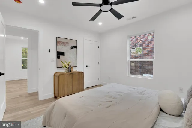 a bedroom with a bed and window