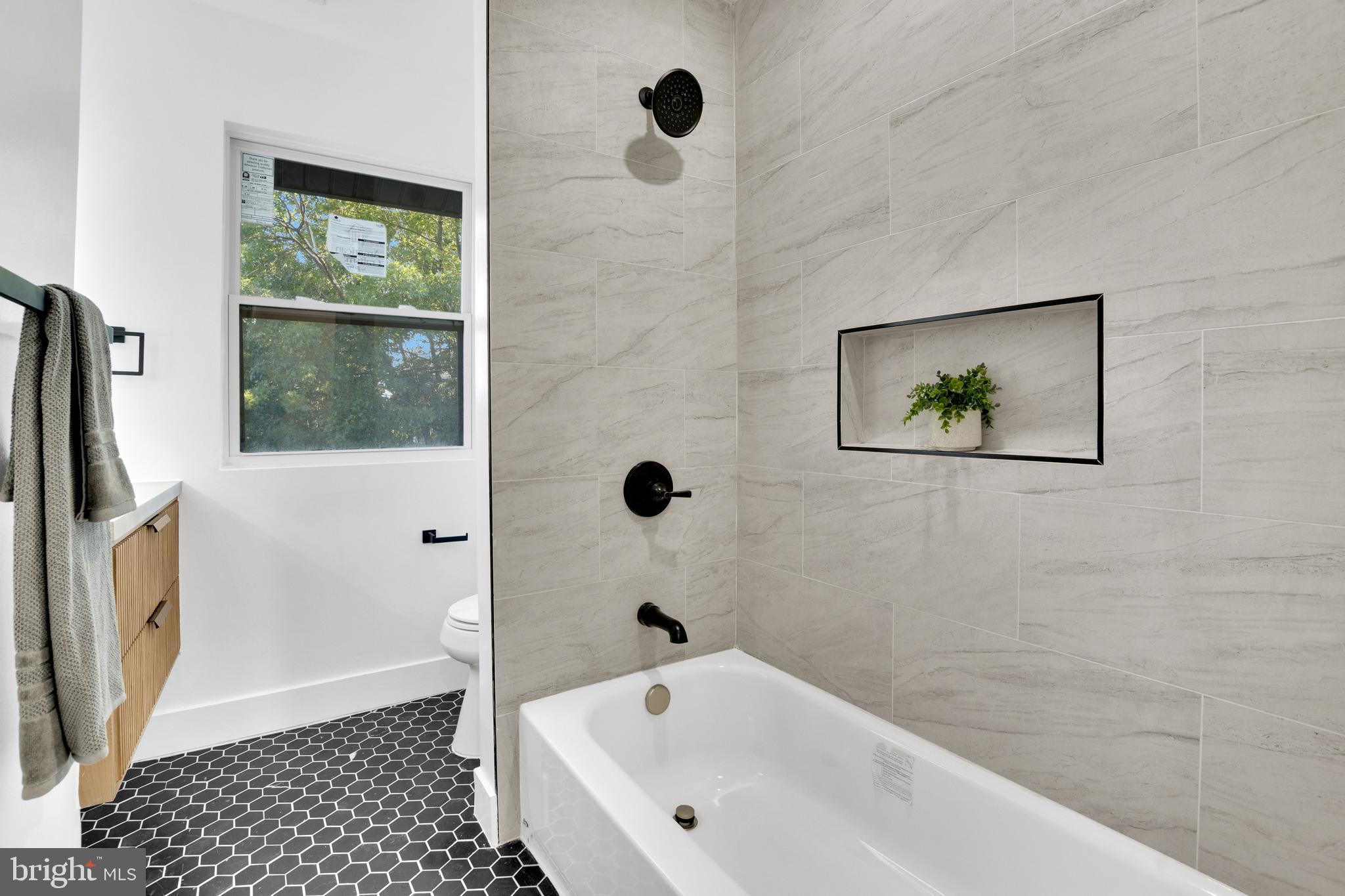 1312 Franklin Street Northeast Washington, DC 20017 - Photo 32 of 42 a bathroom with a bathtub and a shower