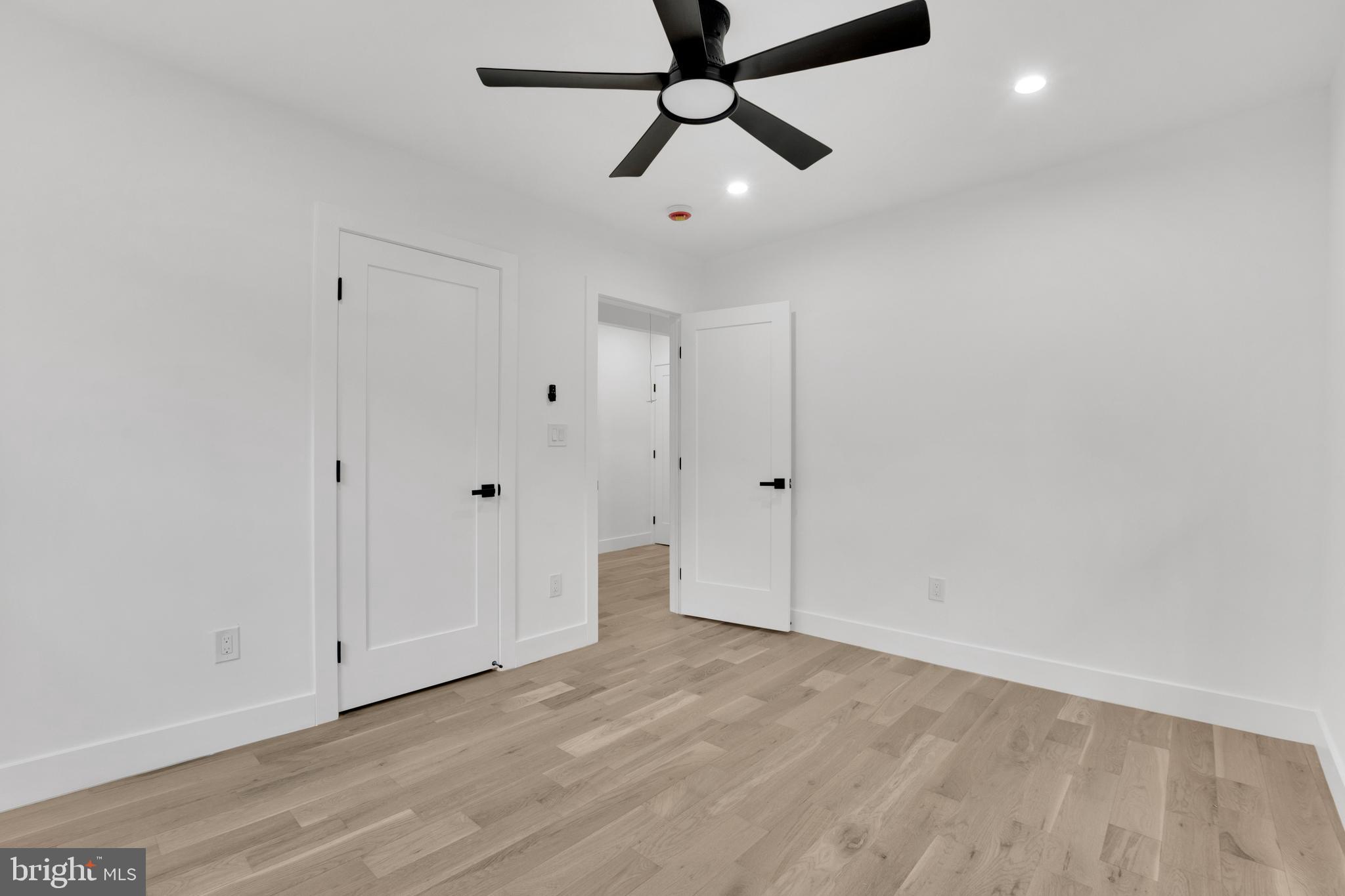 1312 Franklin Street Northeast Washington, DC 20017 - Photo 33 of 42 a view of a room with wooden floor and ceiling fan