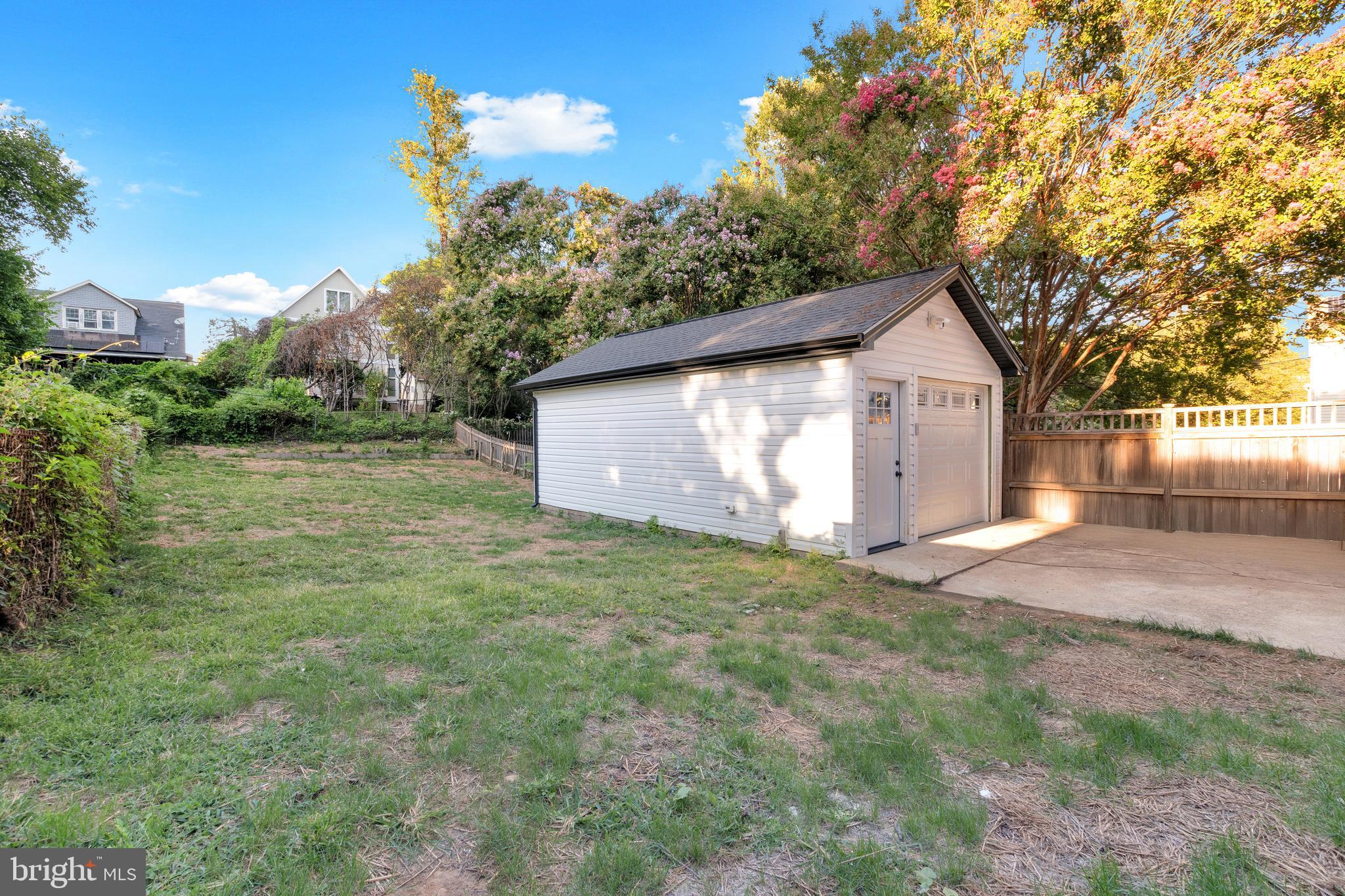 1312 Franklin Street Northeast Washington, DC 20017 - Photo 41 of 42 a view of a house with a yard and garage