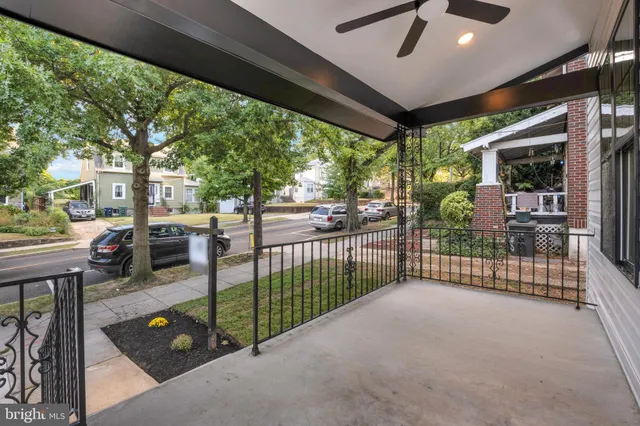 a view of a porch with furniture and garden