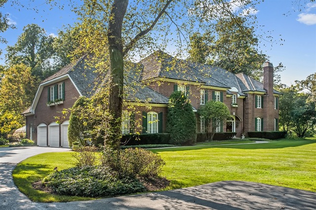 a view of a house with brick walls