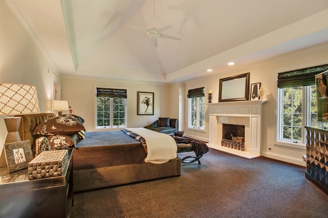 610 South Ridge Road Lake Forest, IL 60045 - Photo 14 of 24 a spacious bedroom with a bed and a fireplace