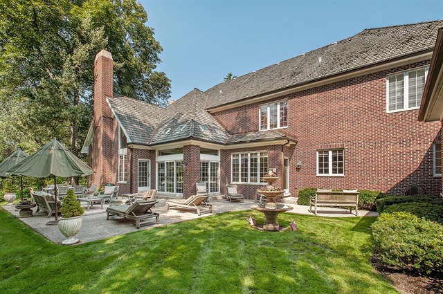 610 South Ridge Road Lake Forest, IL 60045 - Photo 23 of 24 a front view of a house with garden and sitting area
