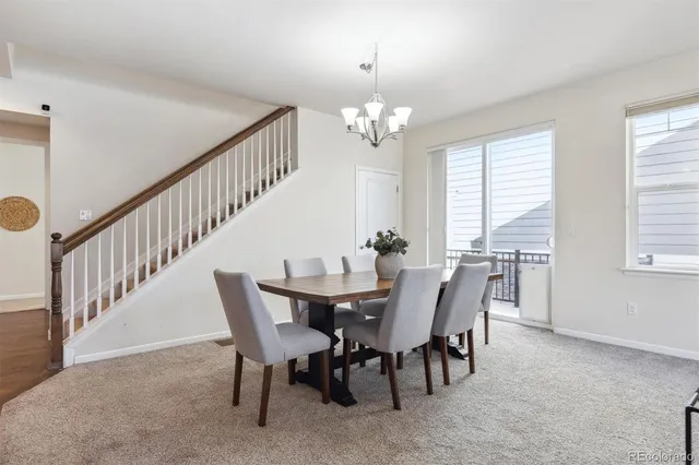 a view of a dining room with furniture window and chandelier