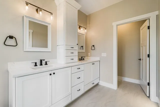 a view of an empty room and wooden floor