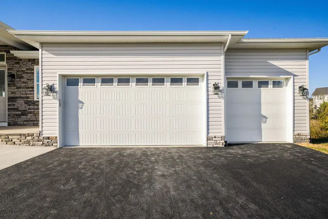 a kitchen with white cabinets and appliances