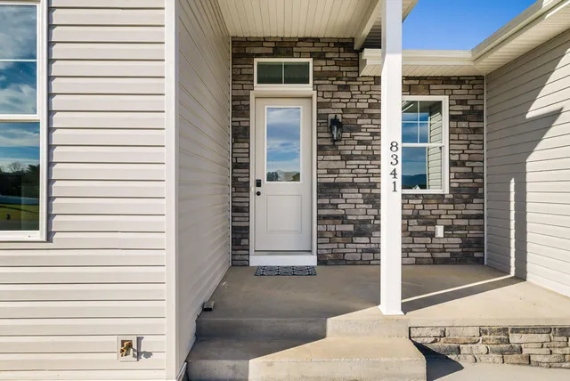 a kitchen with granite countertop a sink and a stove