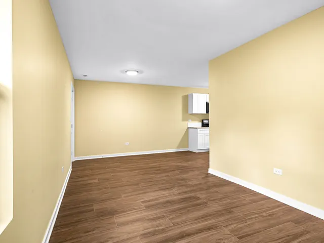 a view of a big room with wooden floor