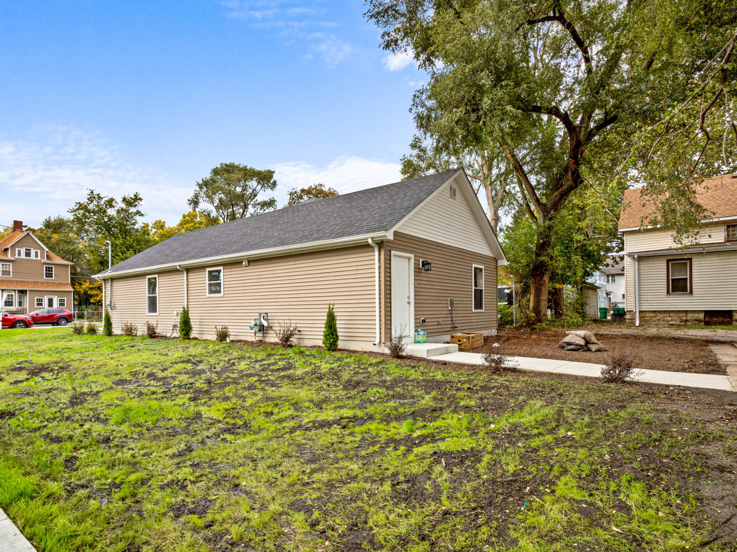 422 Sherman Street Joliet, IL 60433 - Photo 4 of 20 a house with trees in the background