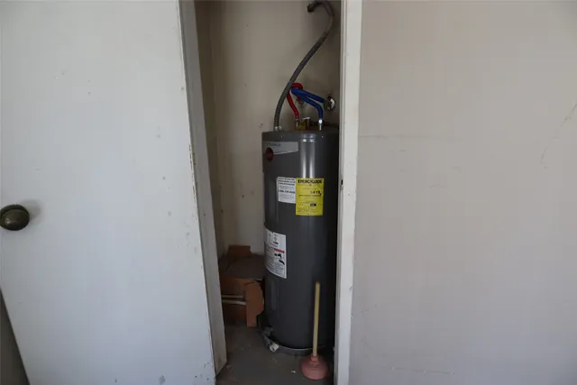 a view of a hallway with wooden floor and stairs