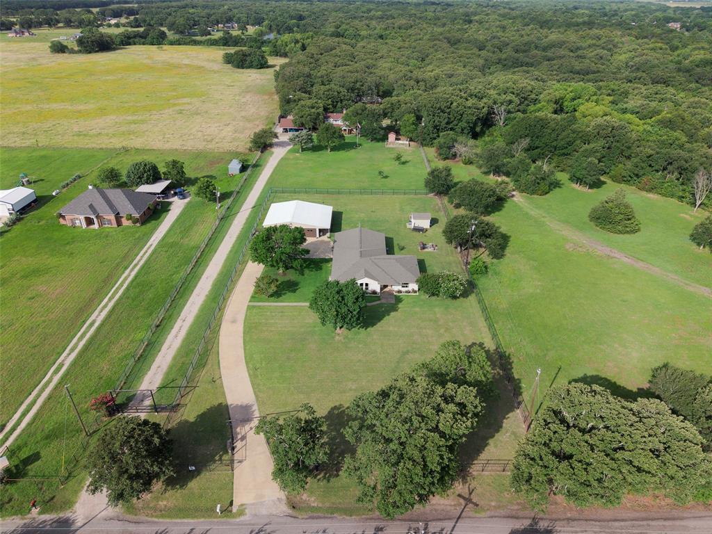 380 Farr Altom Road Seagoville, TX 75159 - Photo 26 of 30 Expansive property featuring a single-story residence, multiple outbuildings, and extensive green space