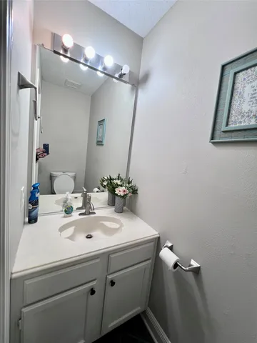 a view of work space with windows and furniture