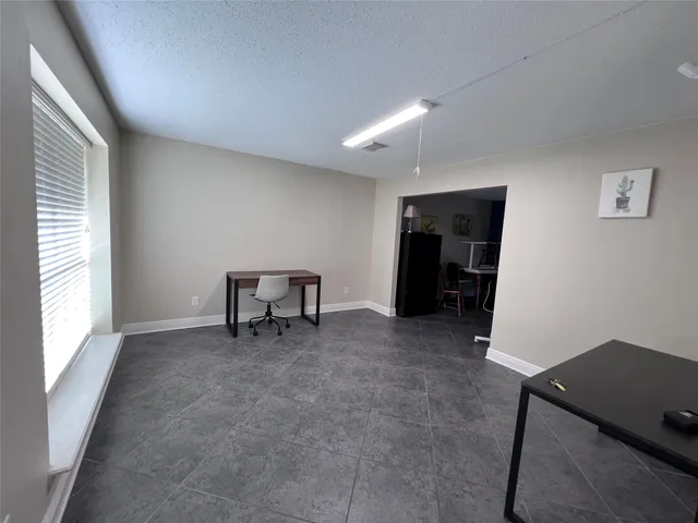 a room with furniture and gym equipment