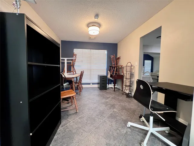 a view of a livingroom with furniture and windows