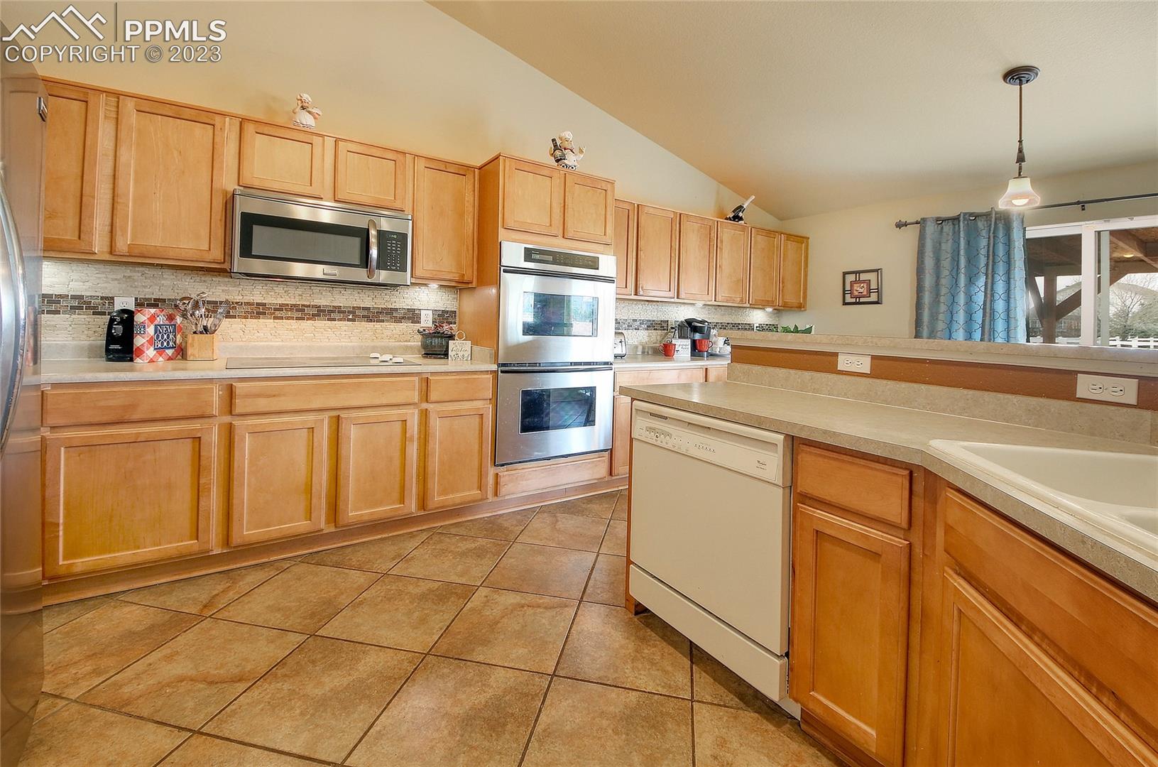 7724 McLaughlin Road Peyton, CO 80831 - Photo 2 of 23 Generous amount of counter space & cabinets
