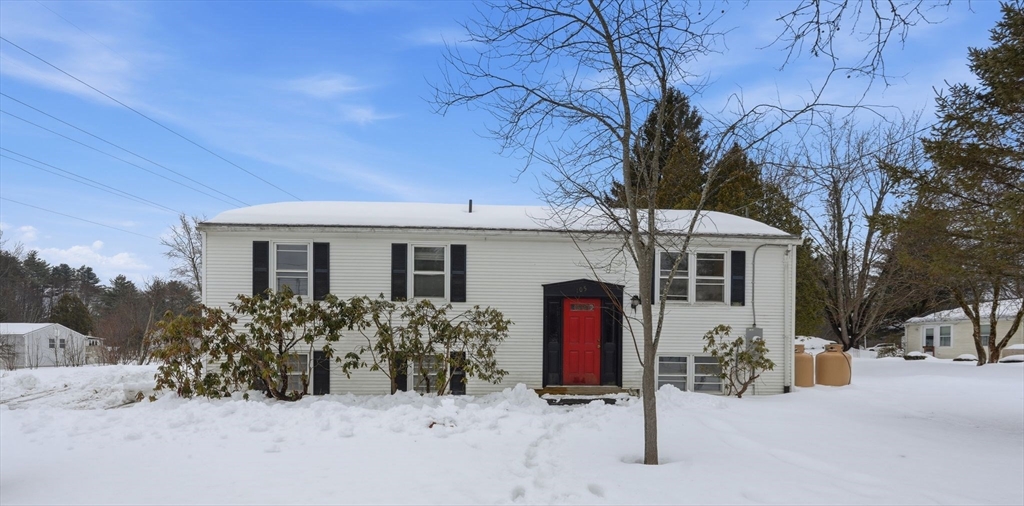 105 Pomeroy Lane Amherst, MA 01002 - Photo 1 of 40 a front view of house with yard and trees in the background