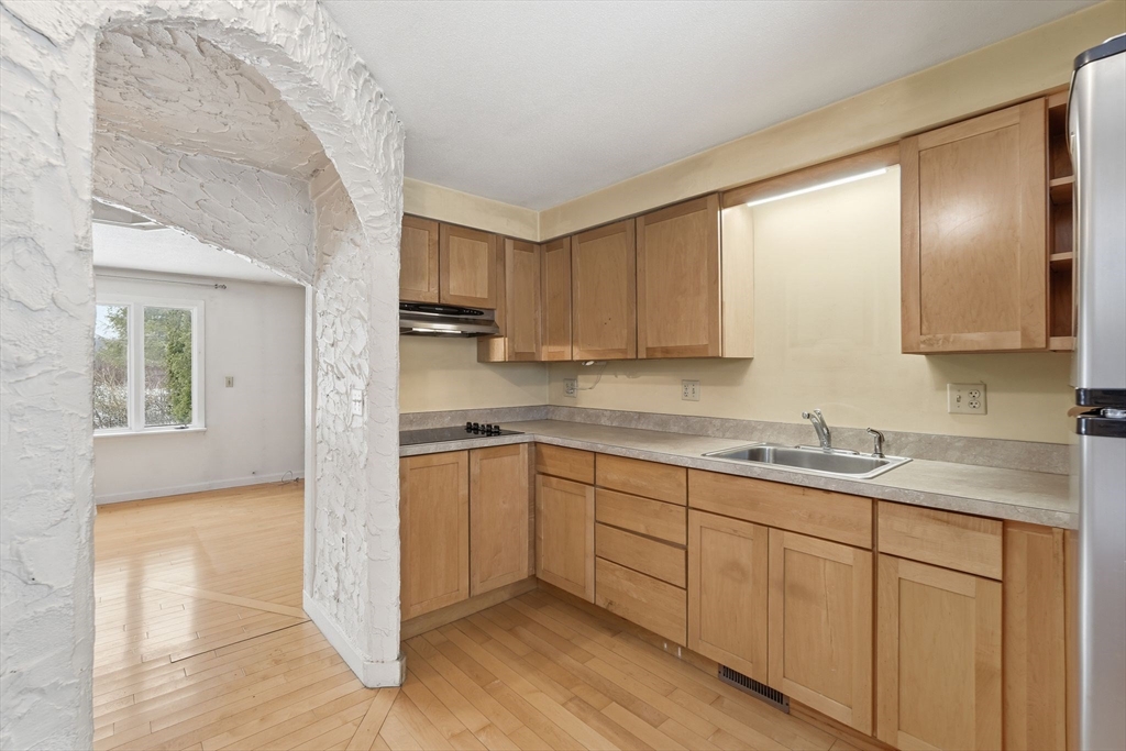105 Pomeroy Lane Amherst, MA 01002 - Photo 16 of 40 a kitchen with a sink cabinets and window