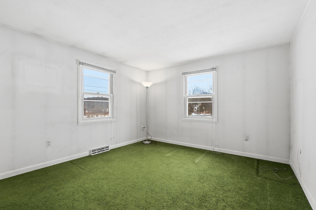 105 Pomeroy Lane Amherst, MA 01002 - Photo 18 of 40 a view of an empty room with a window