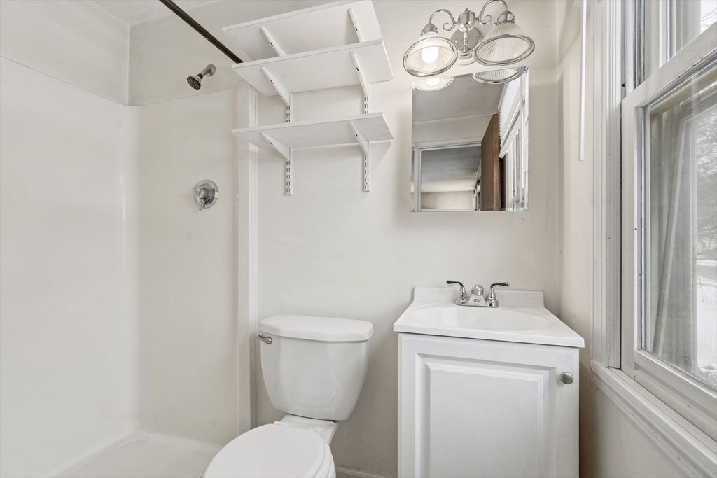 105 Pomeroy Lane Amherst, MA 01002 - Photo 20 of 40 a bathroom with a sink a toilet and a mirror