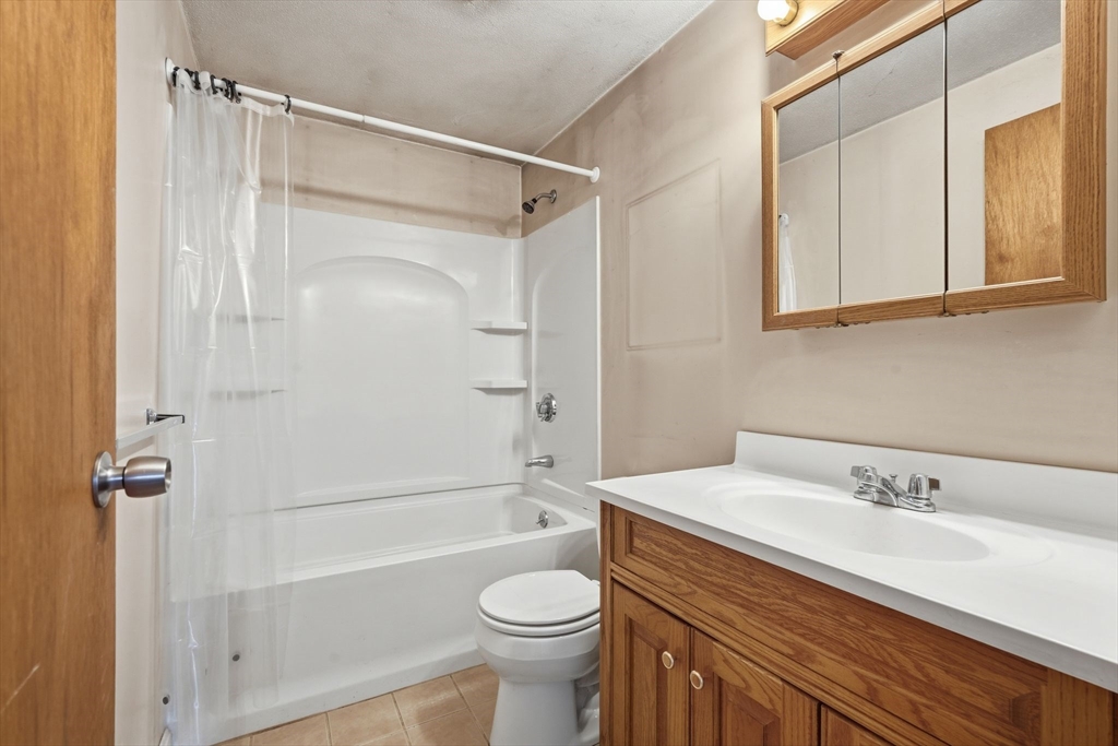 105 Pomeroy Lane Amherst, MA 01002 - Photo 25 of 40 a bathroom with a sink toilet and shower