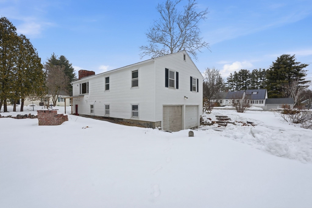 105 Pomeroy Lane Amherst, MA 01002 - Photo 35 of 40 a view of white house with a snow on the road