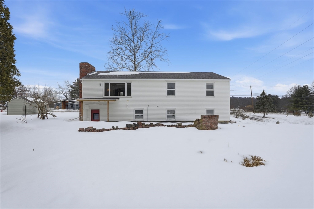 105 Pomeroy Lane Amherst, MA 01002 - Photo 36 of 40 a view of a house with snow on the road