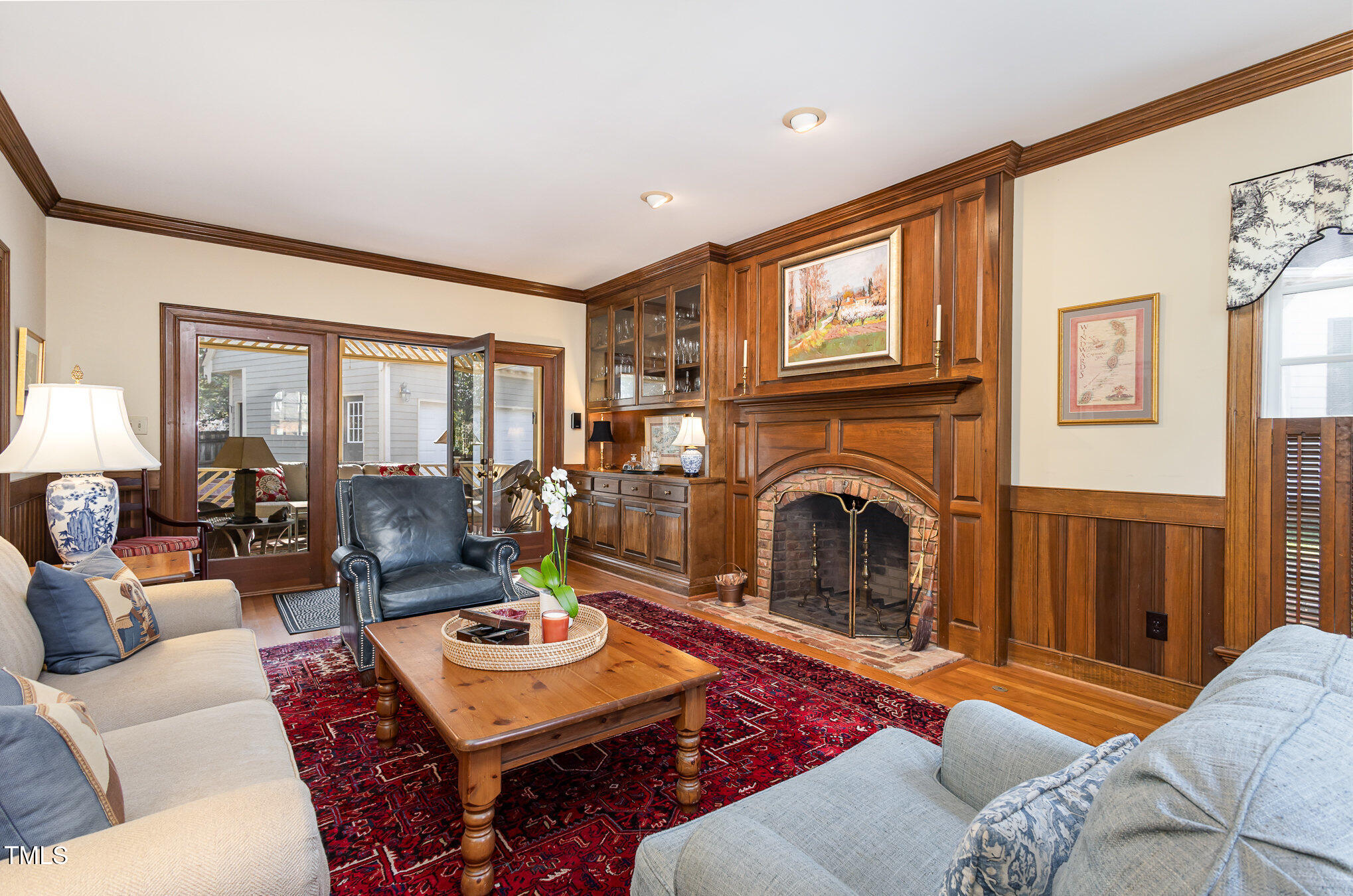 1420 Dogwood Lane Raleigh, NC 27607 - Photo 9 of 37 a living room with furniture a fireplace and a large window