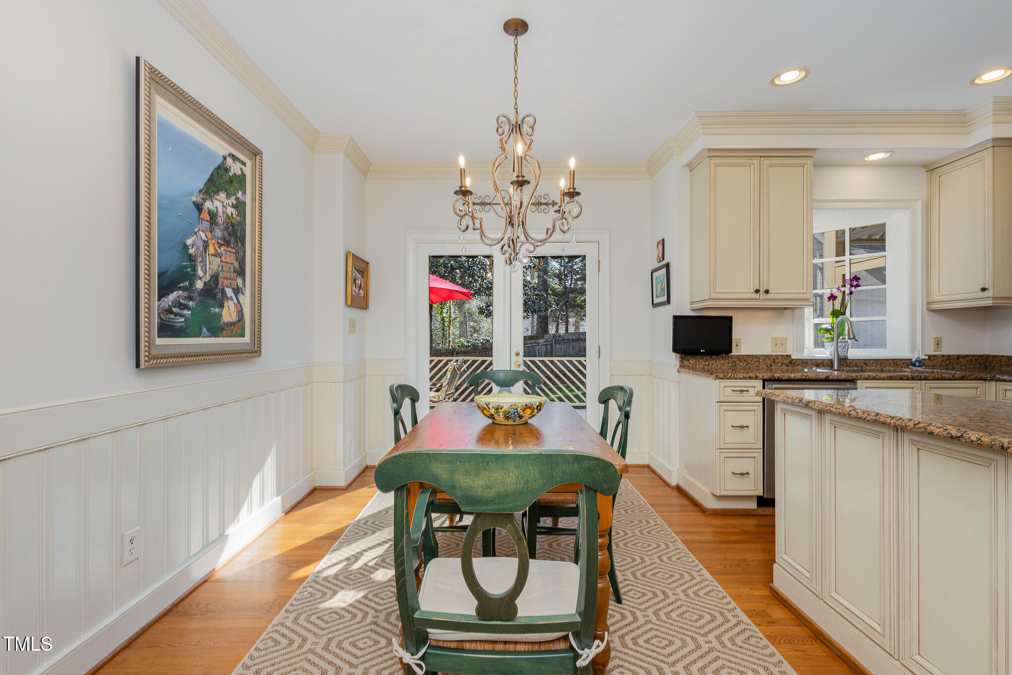 1420 Dogwood Lane Raleigh, NC 27607 - Photo 11 of 37 a living room with stainless steel appliances kitchen island granite countertop furniture and a rug