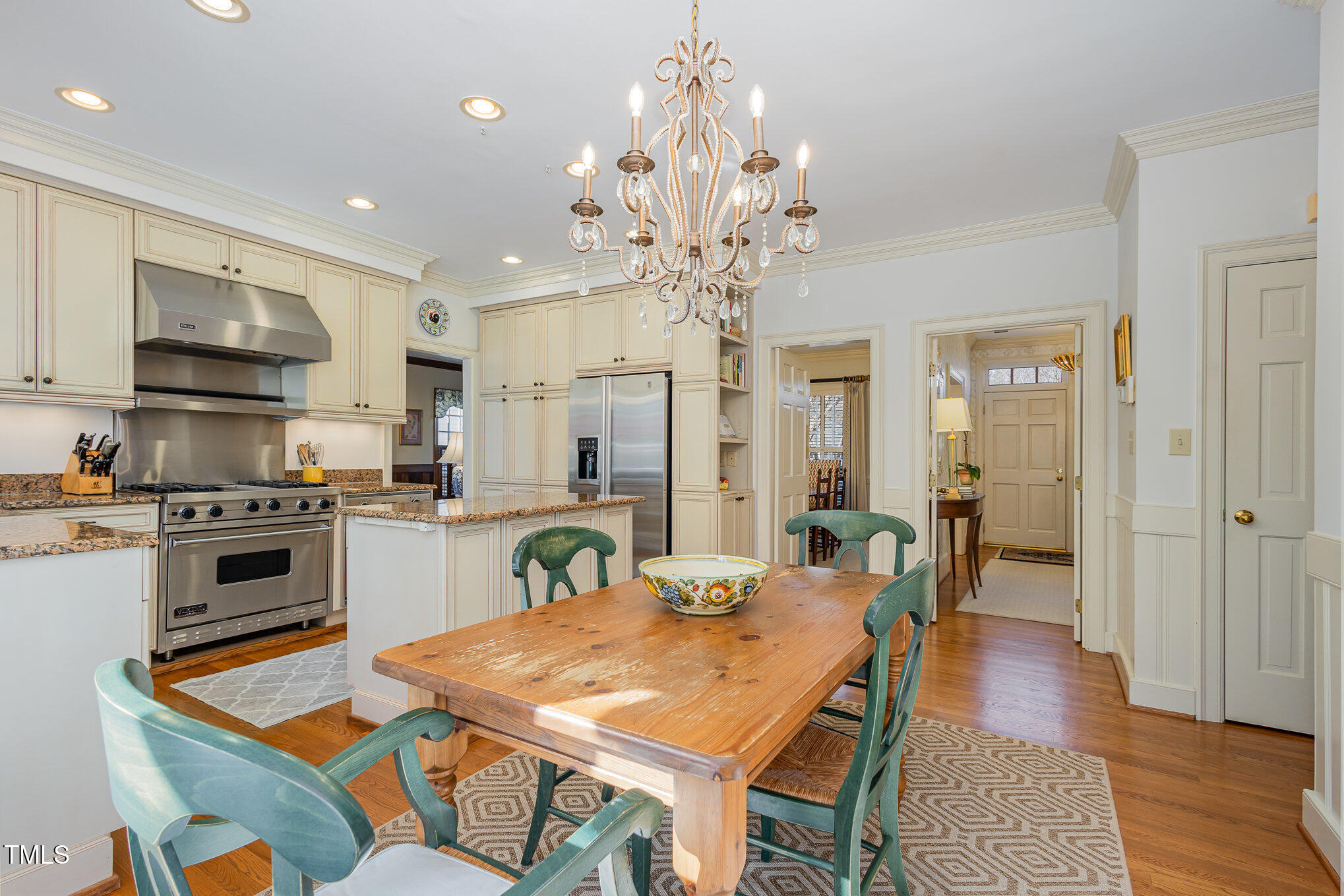 1420 Dogwood Lane Raleigh, NC 27607 - Photo 12 of 37 a kitchen with stainless steel appliances granite countertop a kitchen island a stove a table and chairs