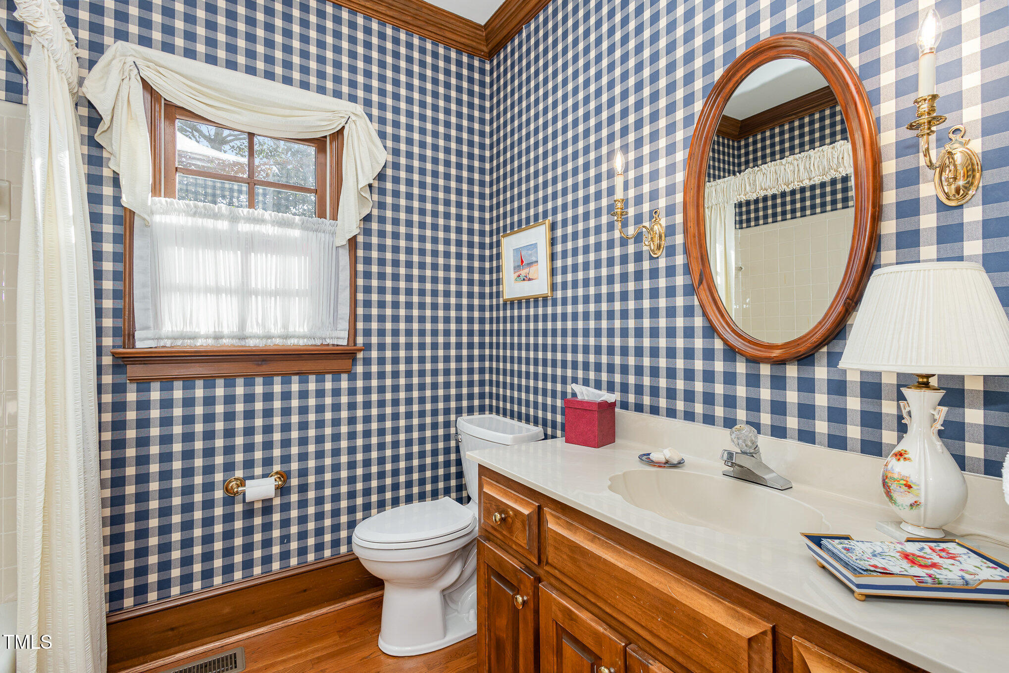 1420 Dogwood Lane Raleigh, NC 27607 - Photo 15 of 37 a bathroom with a sink toilet and a mirror