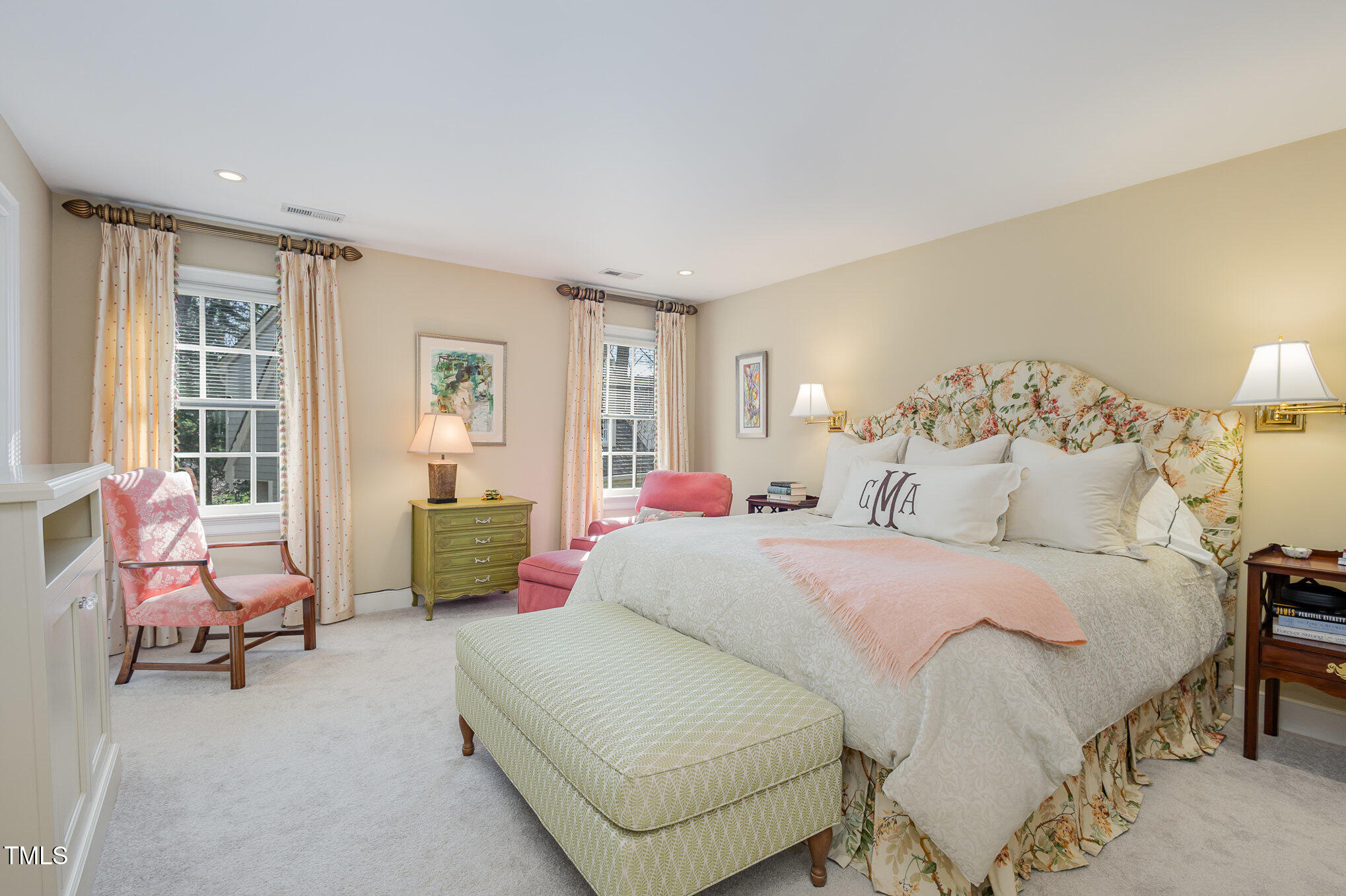 1420 Dogwood Lane Raleigh, NC 27607 - Photo 18 of 37 a spacious bedroom with a bed a table and chair