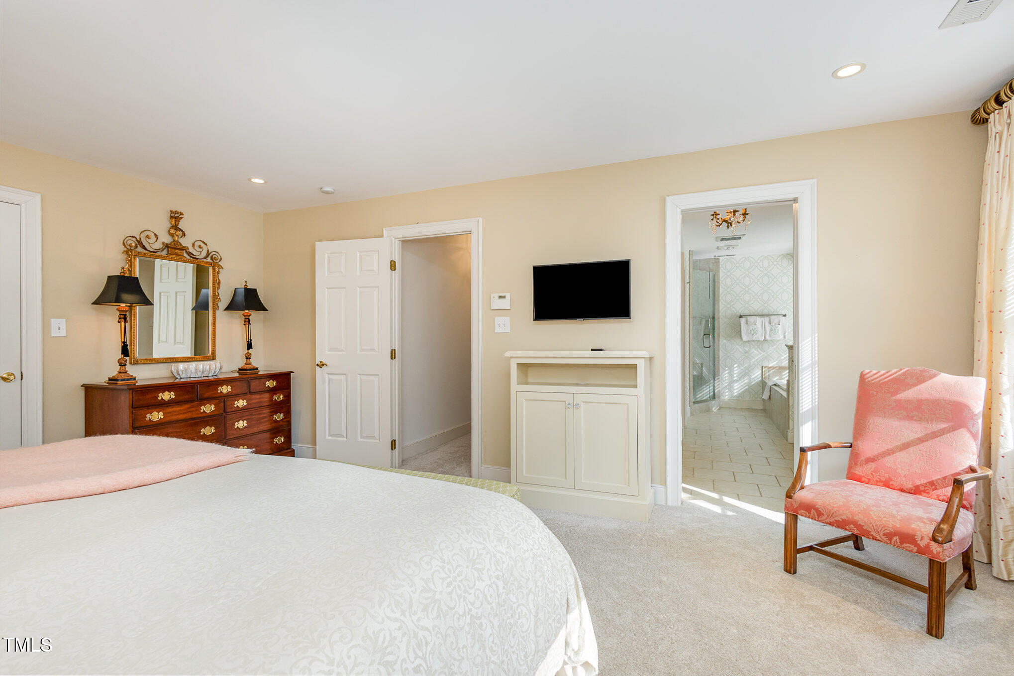 1420 Dogwood Lane Raleigh, NC 27607 - Photo 19 of 37 a bedroom with a bed and a chair