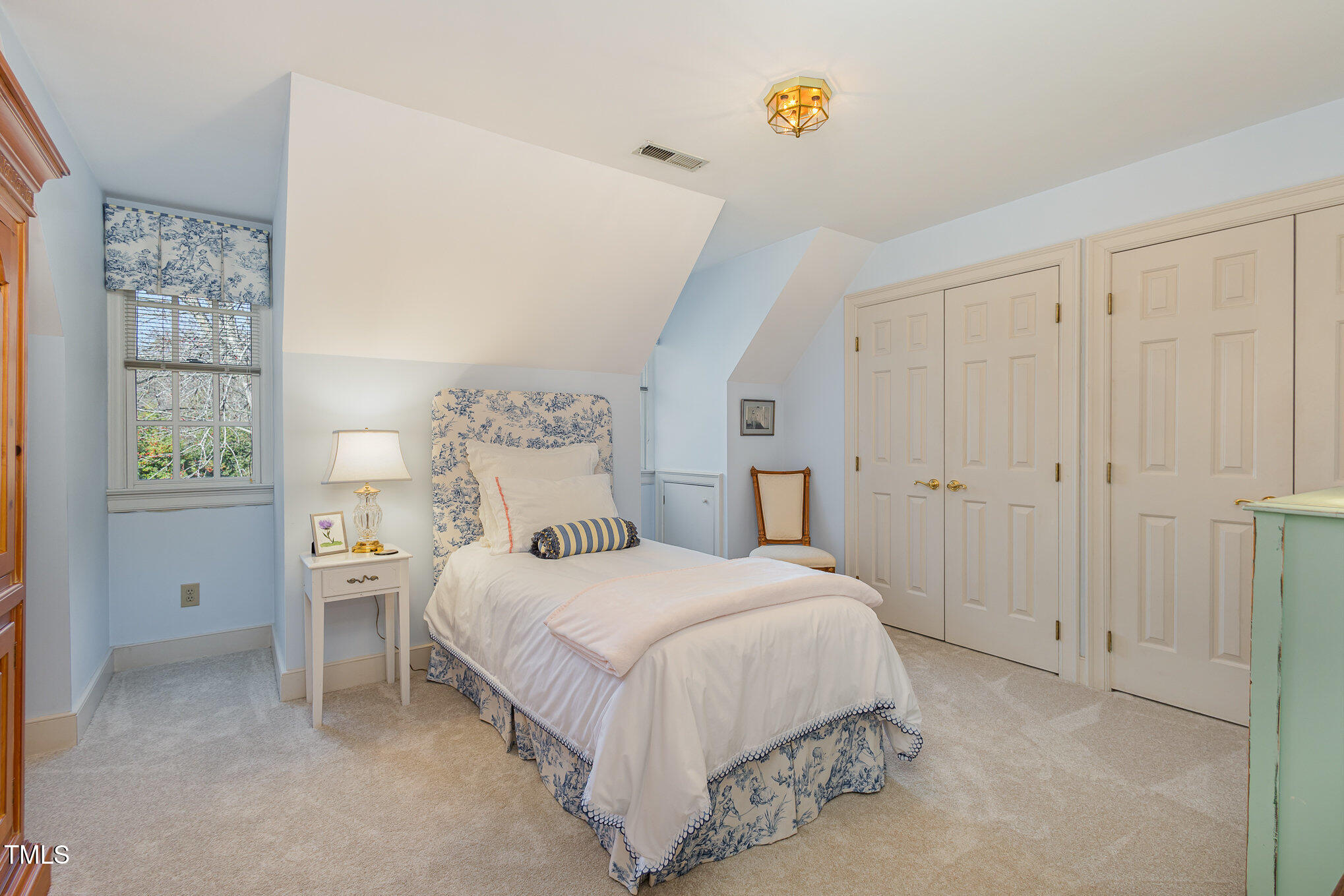1420 Dogwood Lane Raleigh, NC 27607 - Photo 23 of 37 a bedroom with a bed and a window