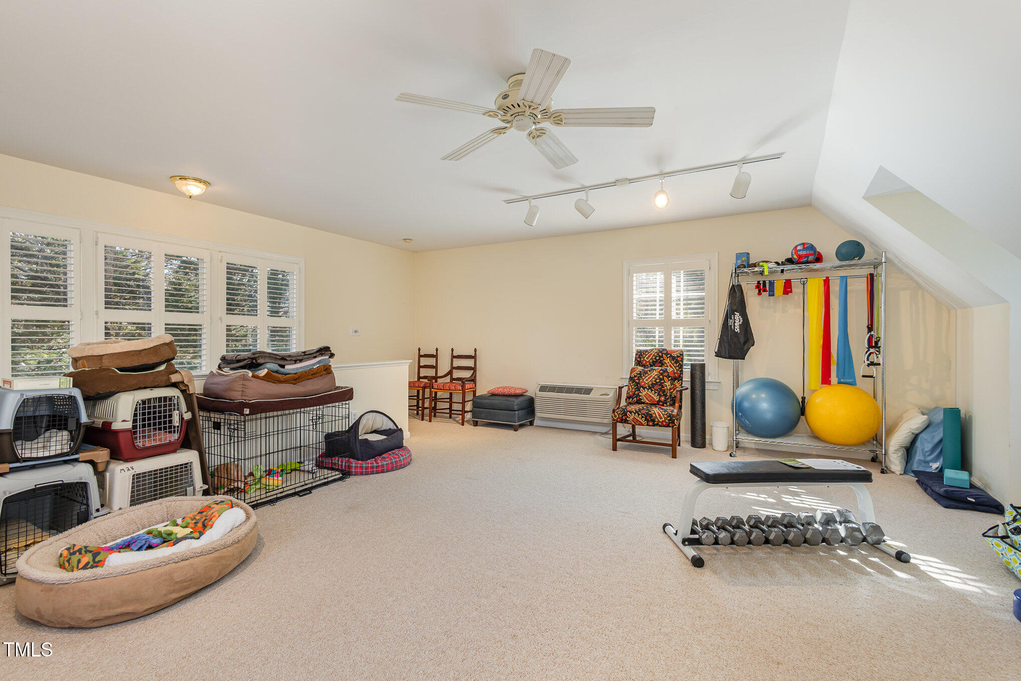 1420 Dogwood Lane Raleigh, NC 27607 - Photo 25 of 37 a living room with furniture and gym equipment